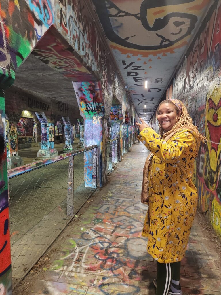 a woman in a yellow outfit is posing for a picture