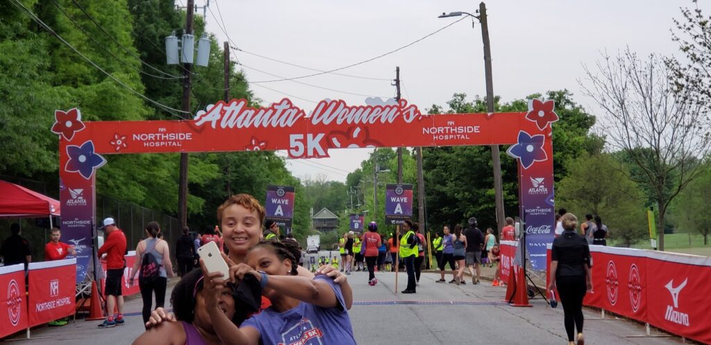 three women clicking selfie at the 5K Run event